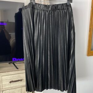 Never worn, pleated, faux leather, long skirt. Elastic waist.